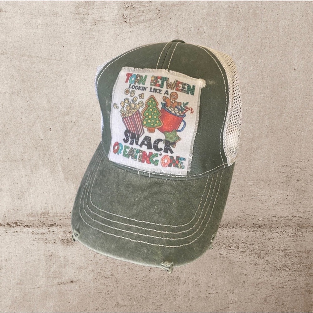 Snap back vintage trucker hat “Torn between looking like a snack or eating one”.